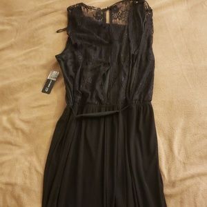 Long dress with lace inlets.